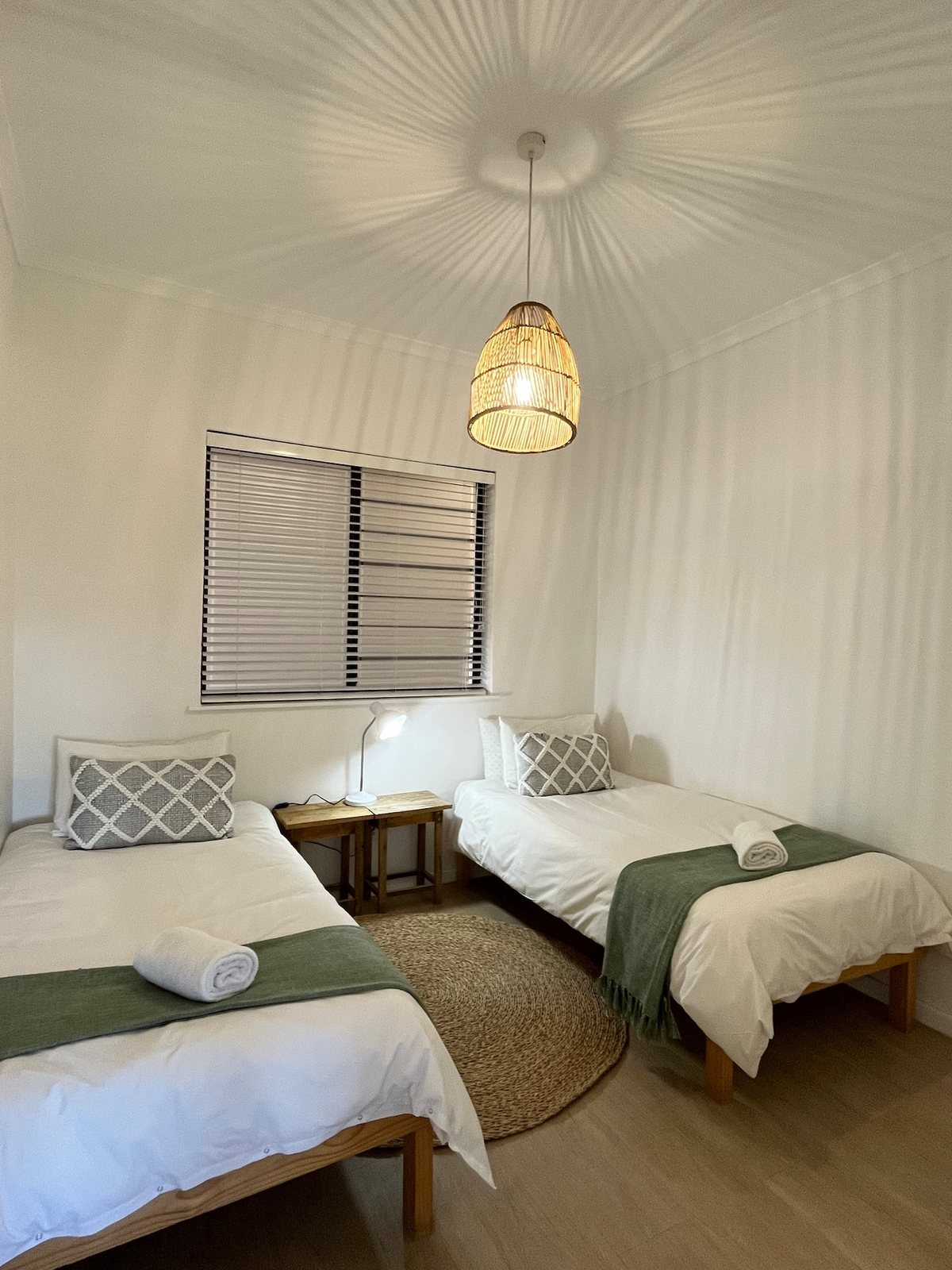 Twin bedroom at Atlantic Apartment with two single beds