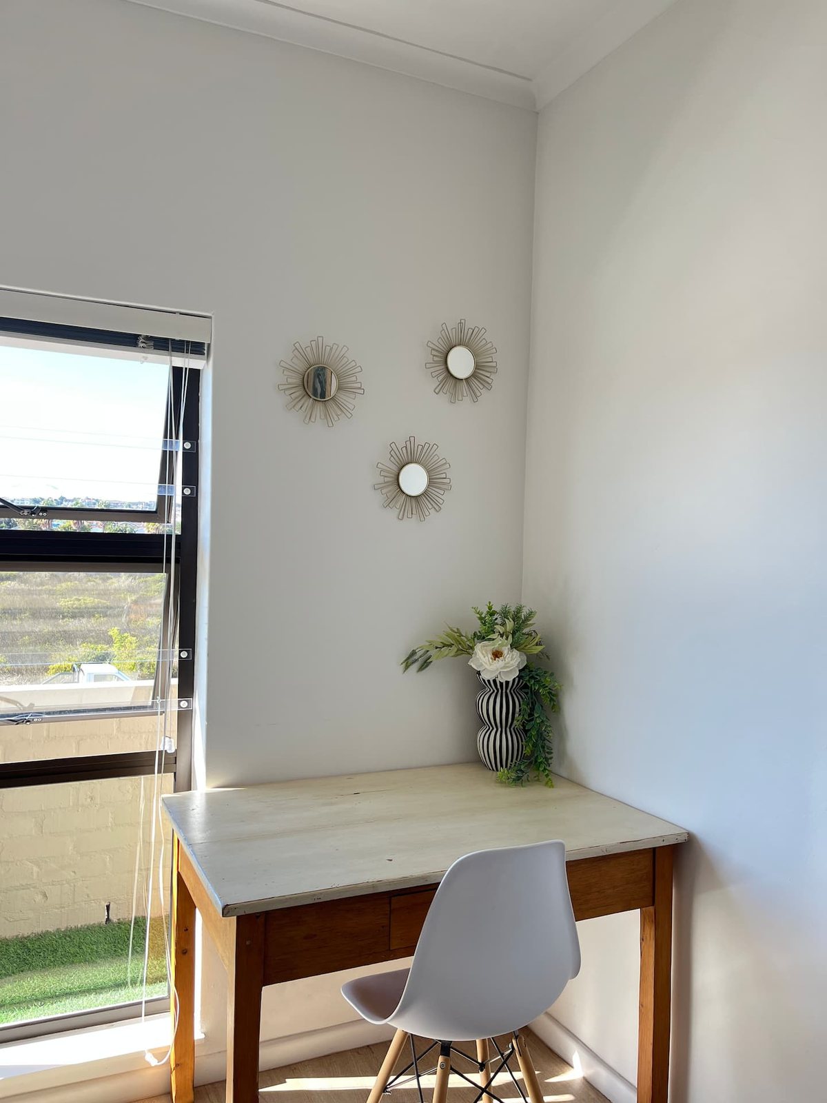 Workspace nook at Atlantic Apartment with a desk and chair