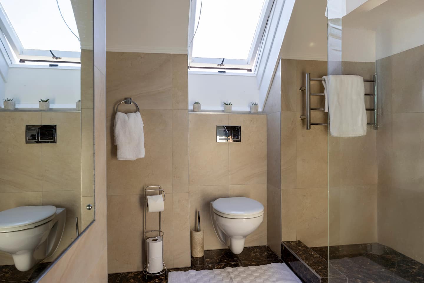 Bathroom at Atlantic Seaview with a walk-in shower and skylight windows