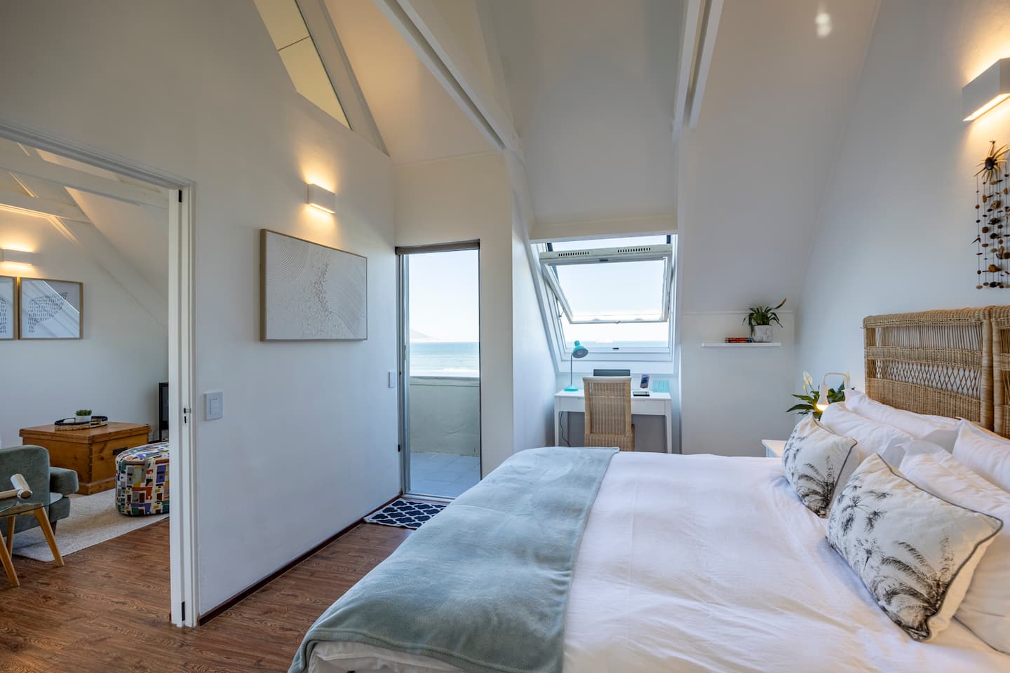 Bedroom at Atlantic Seaview with a rattan headboard, a private balcony and Atlantic Ocean views