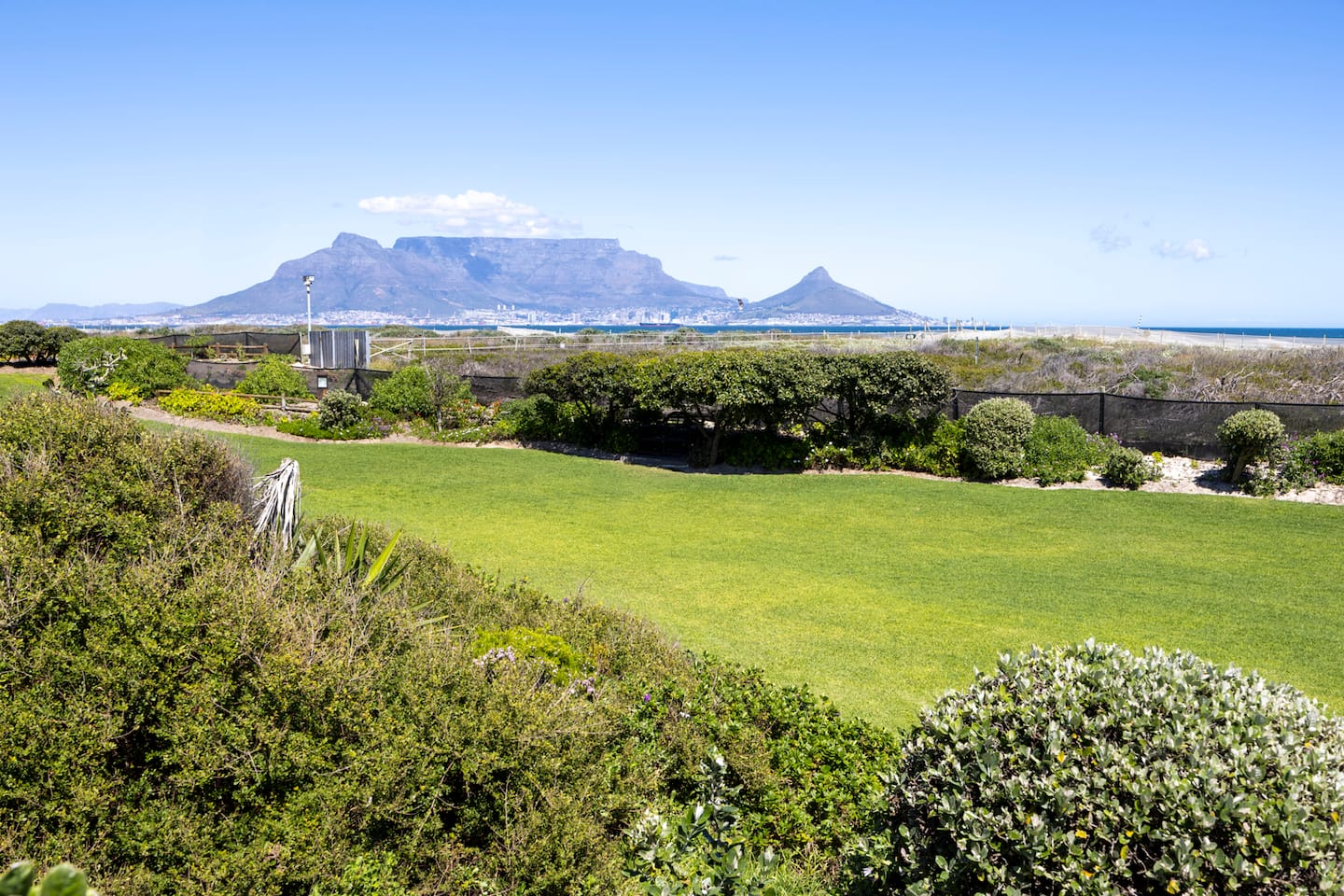 Lawned garden at Dolphin Beach Estate with views across to Table Mountain